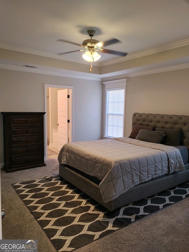 carpeted bedroom featuring ensuite bath, ceiling fan, and crown molding