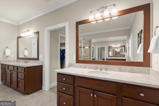 bathroom featuring vanity, tile patterned floors, an enclosed shower, and crown molding