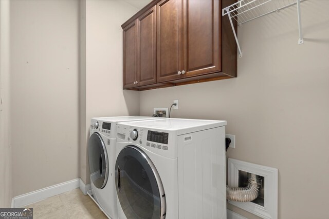 laundry area featuring cabinets and independent washer and dryer