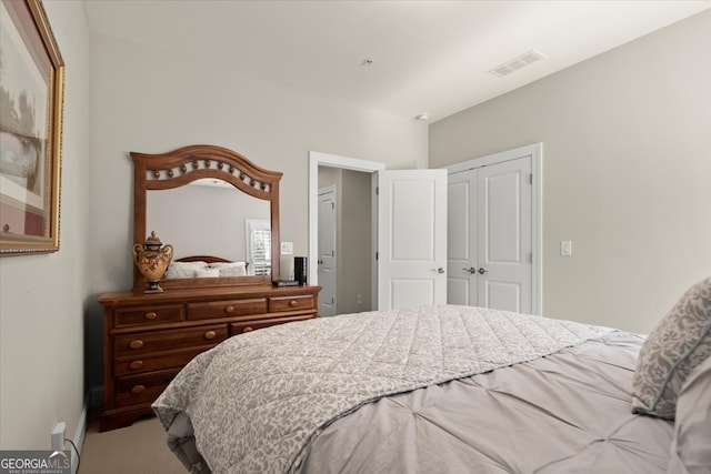 bedroom with carpet flooring and a closet