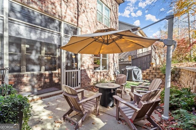 view of patio featuring a fire pit