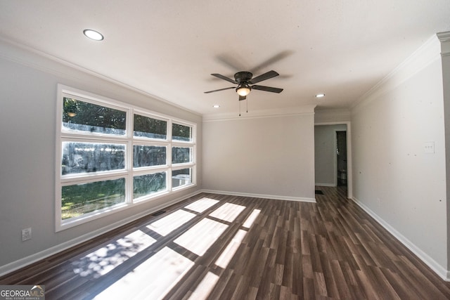 empty room with dark wood-type flooring, ceiling fan, and ornamental molding