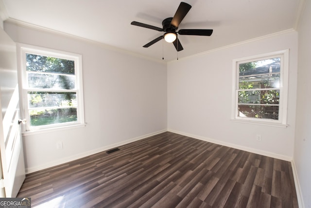 unfurnished room with a healthy amount of sunlight, dark hardwood / wood-style flooring, and crown molding