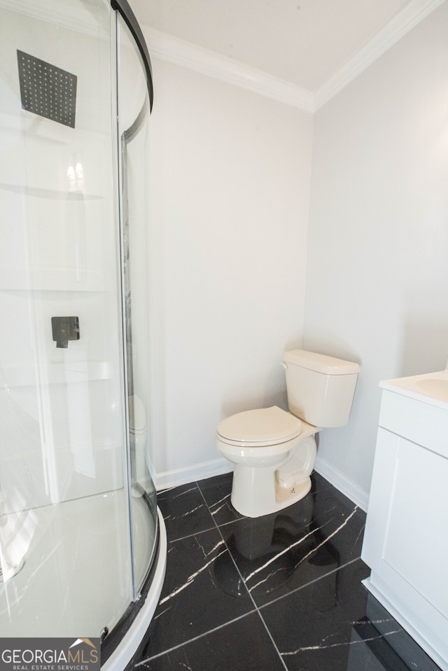 bathroom featuring vanity, a shower with door, tile patterned floors, toilet, and ornamental molding