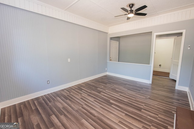 unfurnished room with ceiling fan and dark wood-type flooring