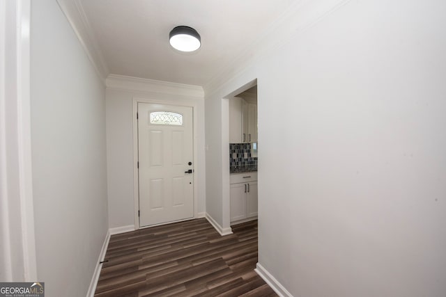 doorway with crown molding and dark wood-type flooring