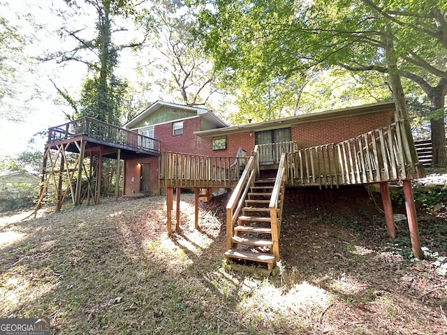 rear view of house featuring a deck