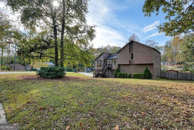 view of home's exterior featuring a lawn