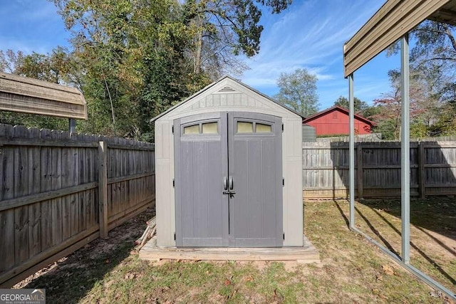 view of outbuilding featuring a yard