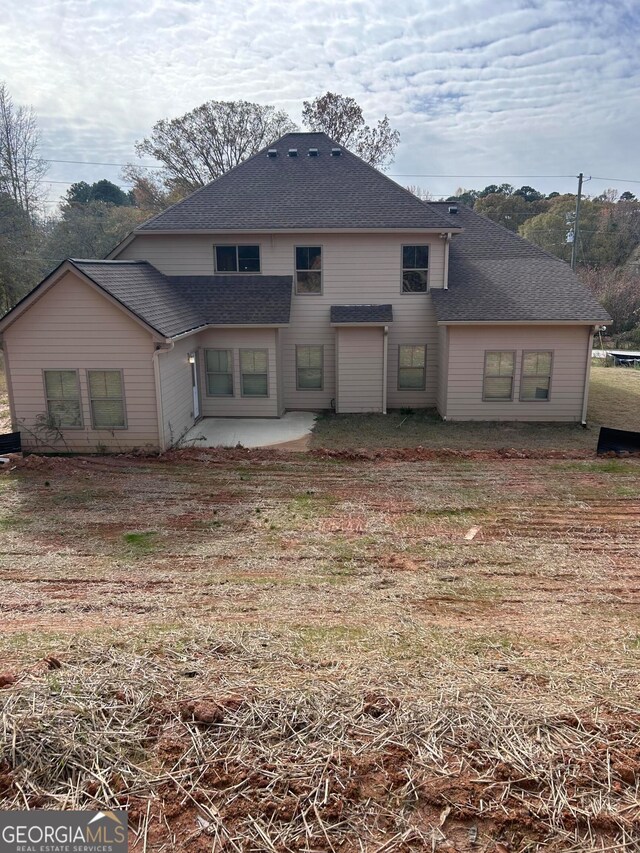 rear view of property featuring a patio area