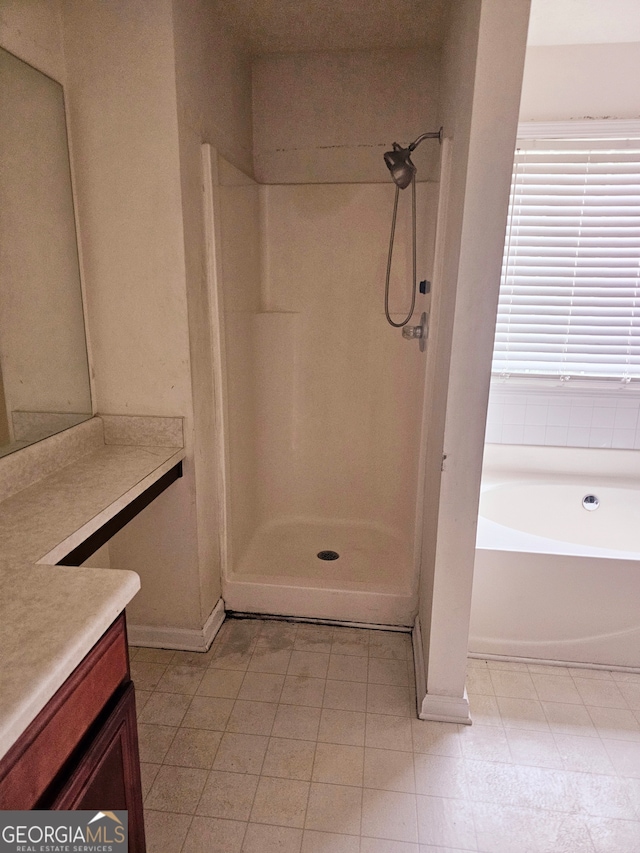 bathroom featuring plus walk in shower and vanity