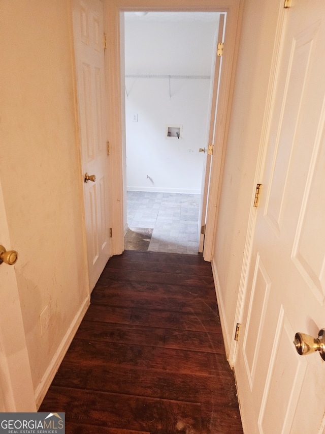 hallway featuring dark hardwood / wood-style floors