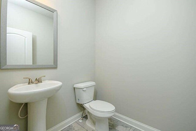 bathroom with sink and toilet