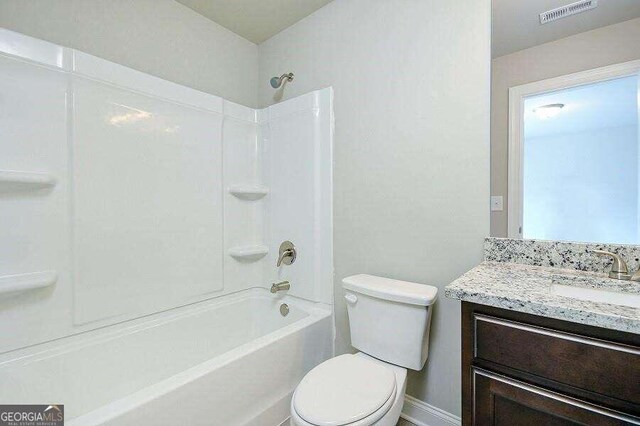 full bathroom featuring vanity, shower / bathtub combination, and toilet