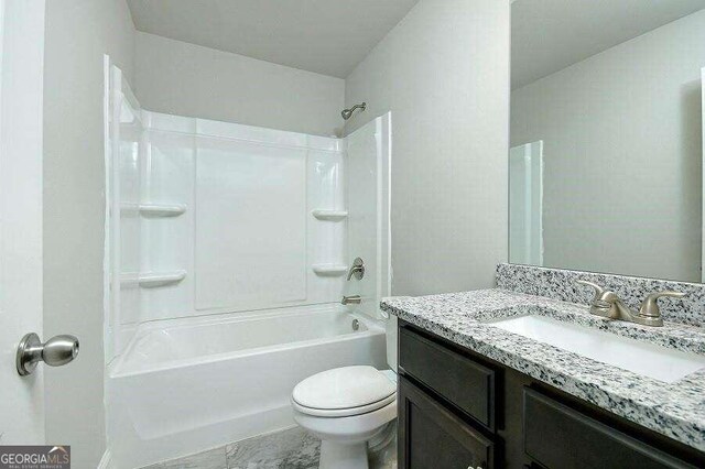 full bathroom featuring vanity, shower / washtub combination, and toilet