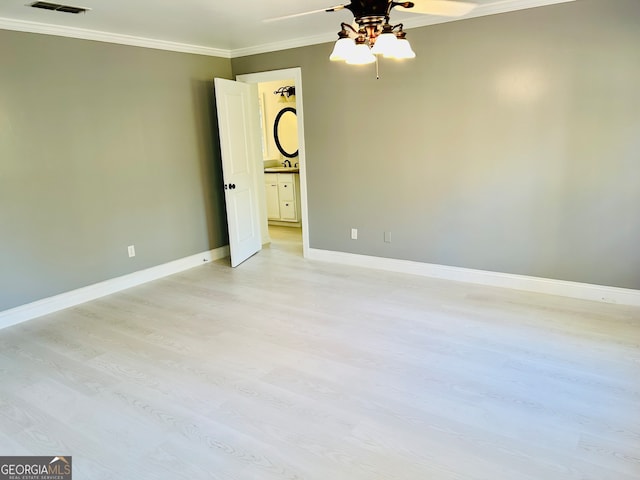 unfurnished room featuring crown molding, ceiling fan, and light hardwood / wood-style floors