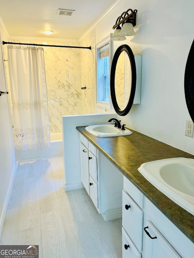 bathroom with shower / bath combination with curtain, vanity, hardwood / wood-style flooring, and crown molding