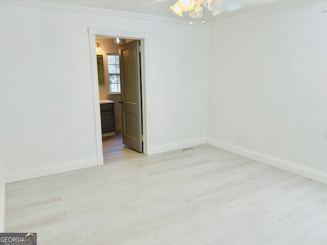 unfurnished room with ceiling fan, ornamental molding, and light wood-type flooring