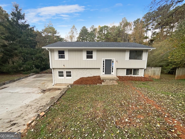 bi-level home with a front yard