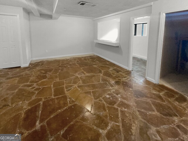 interior space featuring a textured ceiling