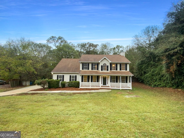 colonial home featuring a front yard and a porch