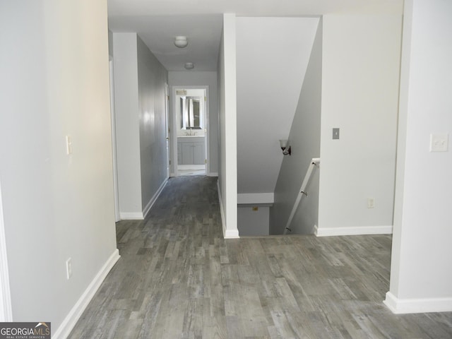 corridor with wood-type flooring