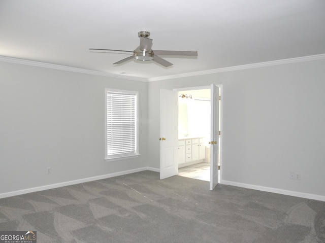 unfurnished room featuring carpet, ceiling fan, and ornamental molding