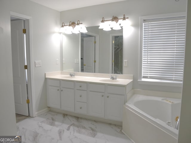 bathroom with vanity and a tub to relax in