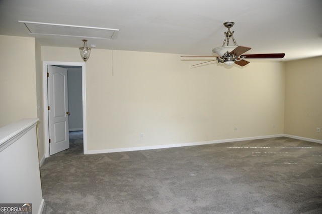 spare room with ceiling fan and carpet