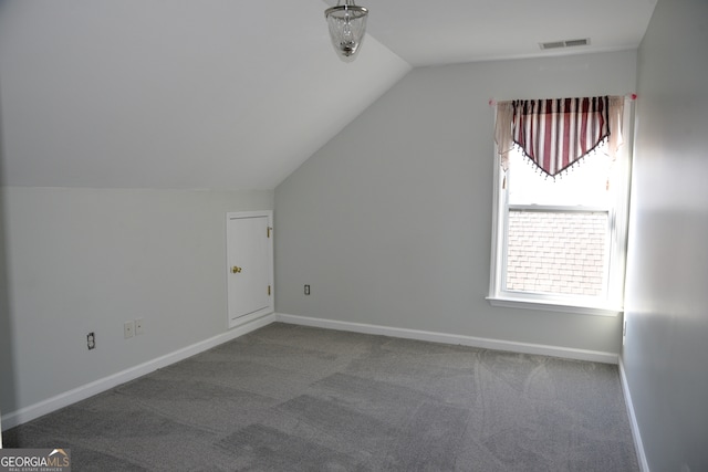 bonus room with carpet and lofted ceiling