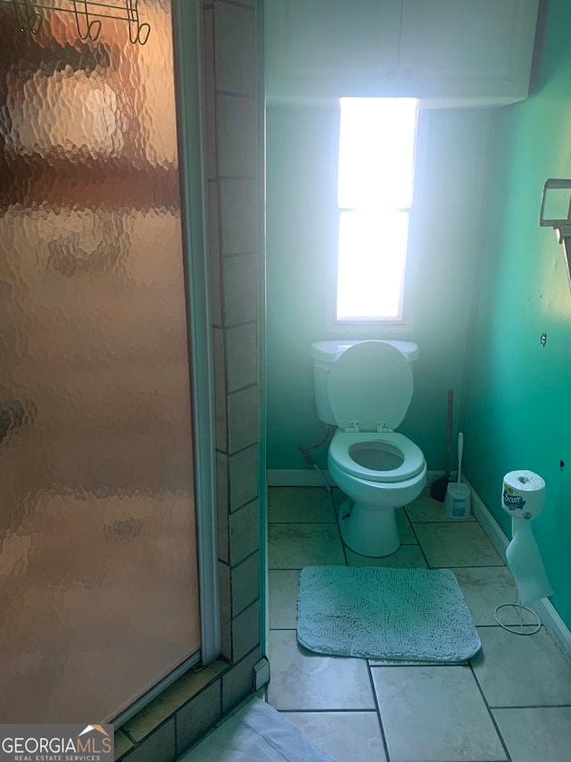 bathroom with tile patterned floors