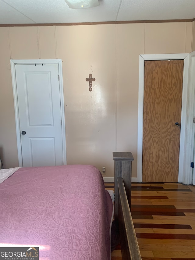 bedroom featuring dark hardwood / wood-style flooring