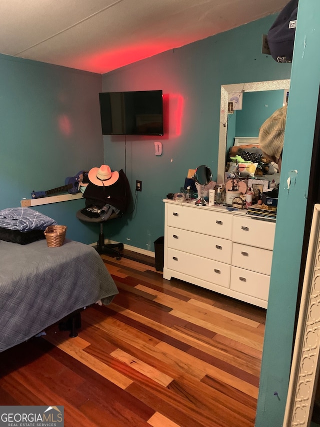 bedroom featuring dark hardwood / wood-style floors