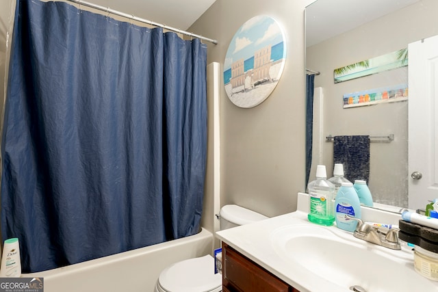 full bathroom featuring shower / bath combination with curtain, vanity, and toilet