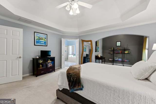 carpeted bedroom featuring a raised ceiling, ceiling fan, and ornamental molding