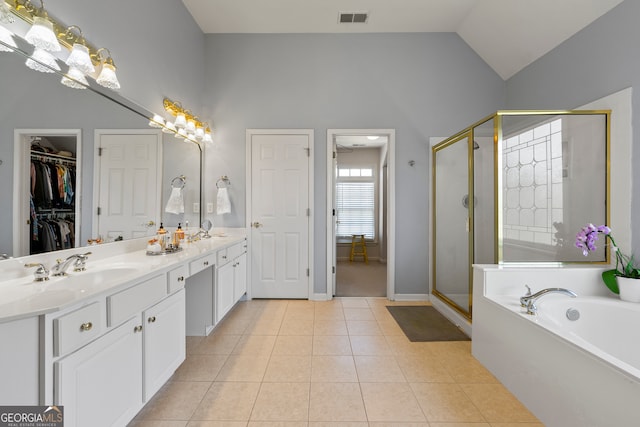 bathroom with vanity, tile patterned flooring, plus walk in shower, and high vaulted ceiling