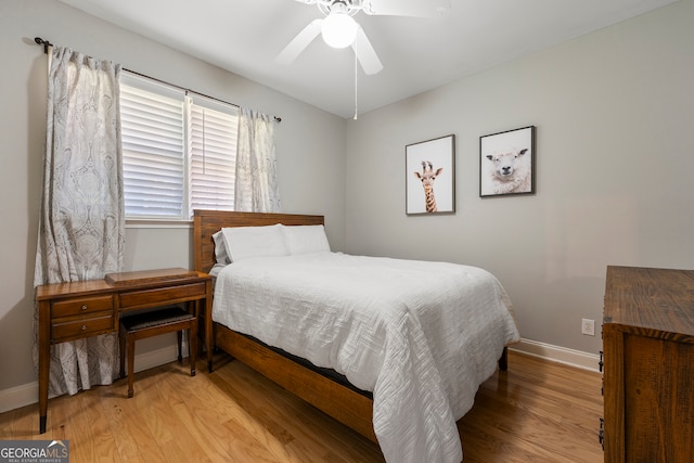 bedroom with ceiling fan and light hardwood / wood-style floors