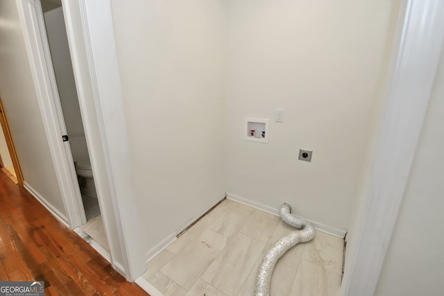 clothes washing area featuring electric dryer hookup, hookup for a washing machine, and hardwood / wood-style floors