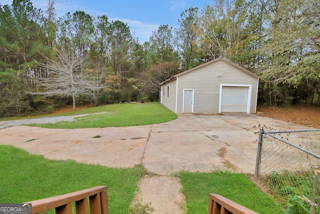 garage featuring a yard