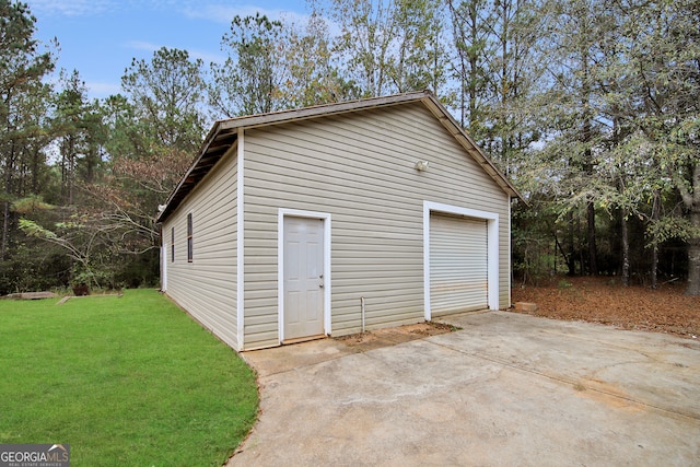 garage featuring a yard