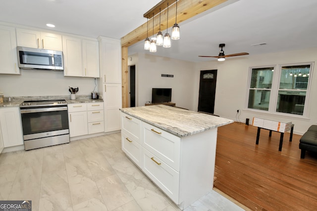 kitchen with stainless steel appliances and white cabinetry