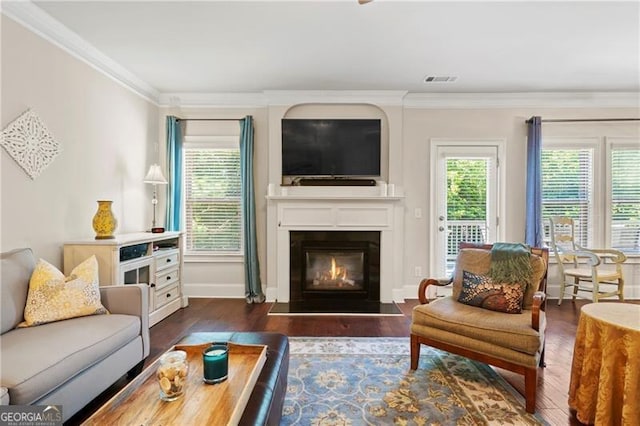 living room featuring dark hardwood / wood-style floors and ornamental molding