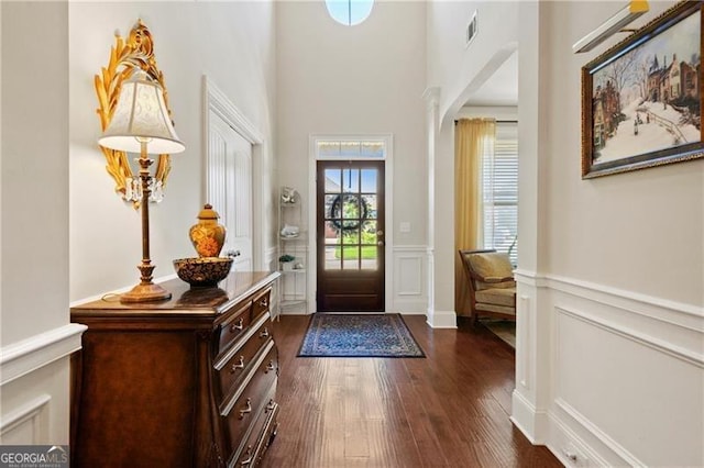 foyer featuring dark wood-type flooring