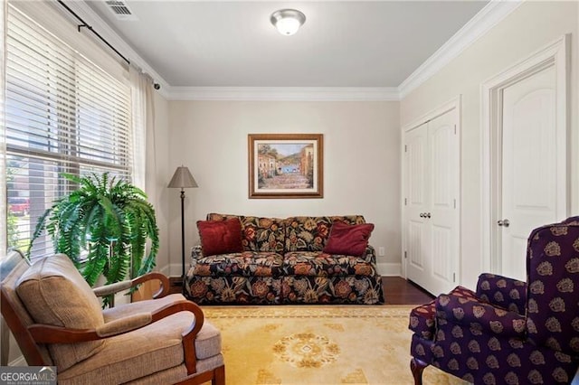 living room featuring crown molding and hardwood / wood-style floors