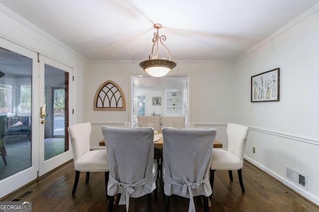 dining space featuring a wealth of natural light, dark wood-type flooring, and ornamental molding