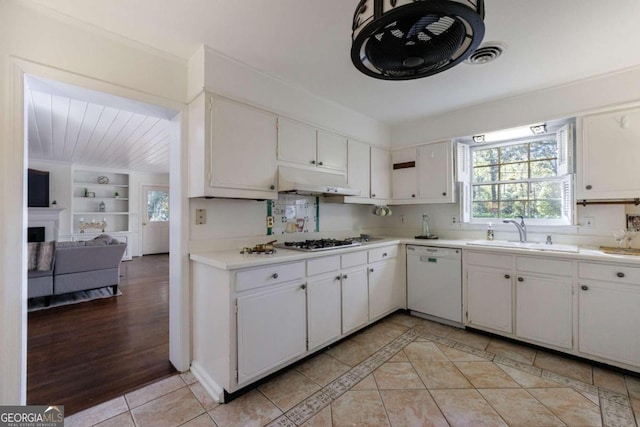 kitchen featuring white cabinetry, sink, and white dishwasher