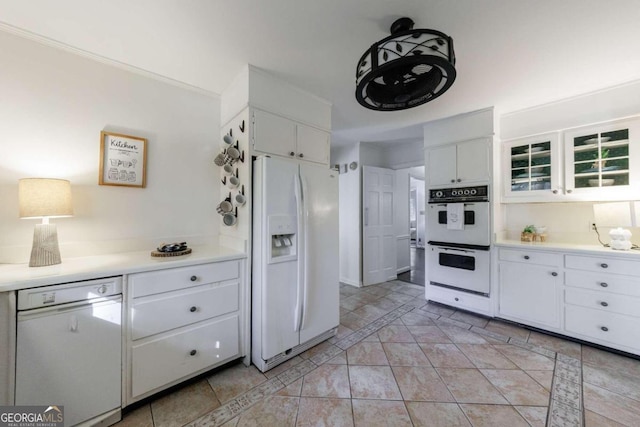 kitchen with white cabinets and white appliances