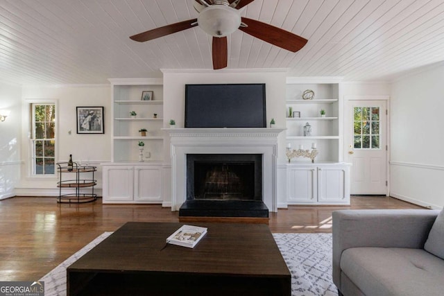 living room featuring dark hardwood / wood-style flooring, wood ceiling, and ornamental molding