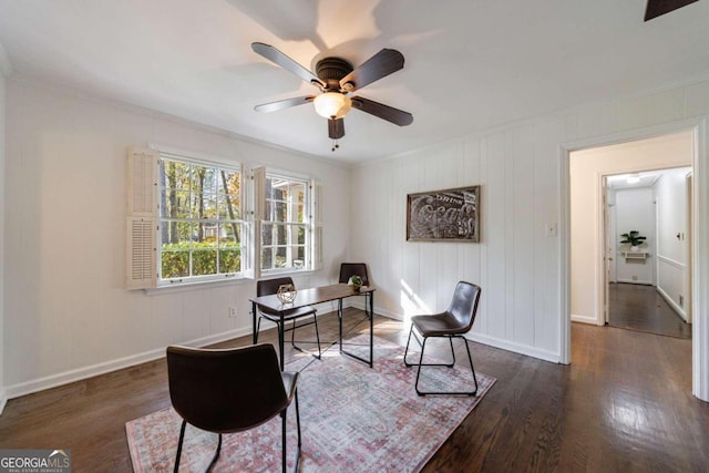 home office with ceiling fan, ornamental molding, and dark wood-type flooring