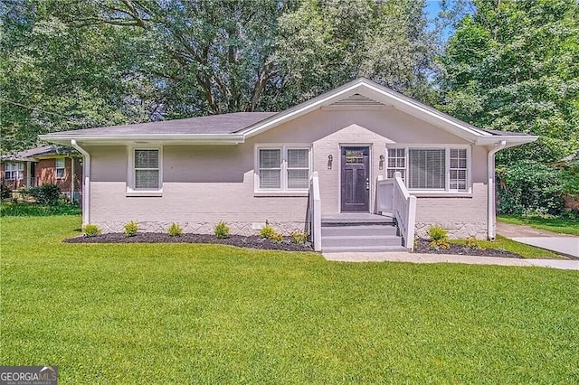 ranch-style house with a front yard